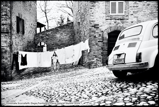 Girl on a street between laundry